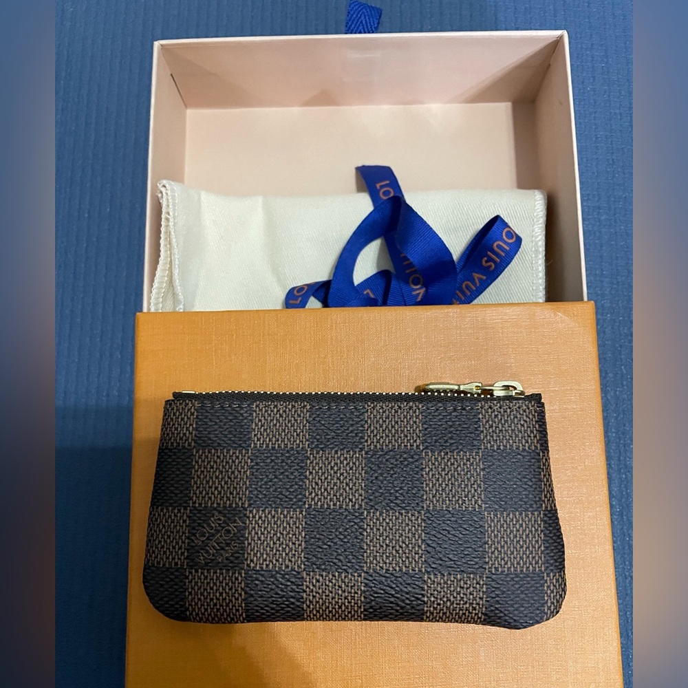 Authentic Louis Vuitton key pouch in Damier Ebene